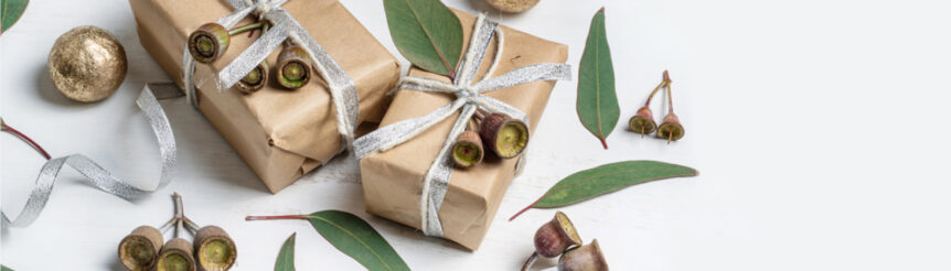 Gifts wrapped and surrounded by gum nuts and gum leaves